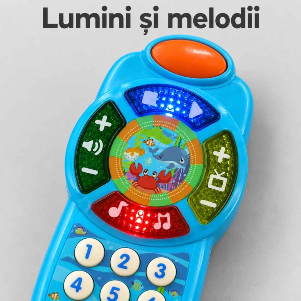 Detaliu cu luminile aprinse și butoanele muzicale ale telefonului de jucărie