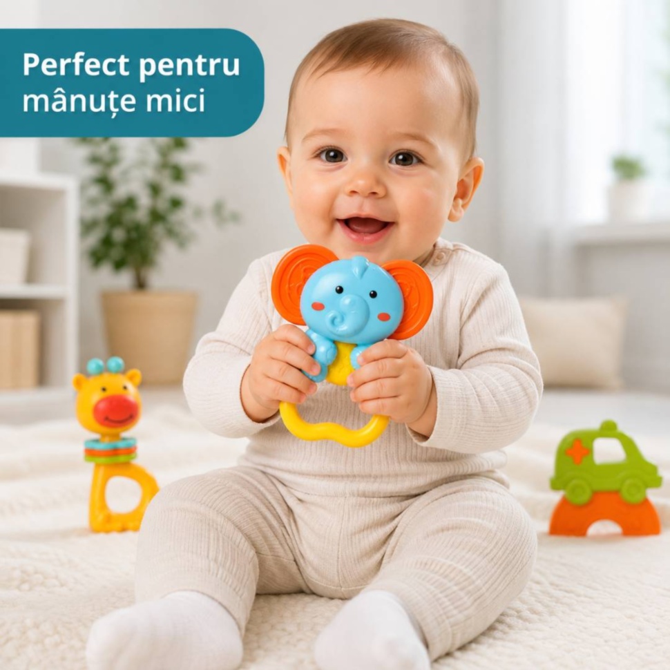 Bebeluș ține zornăitoarea elefant și se joacă