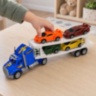 Camion transportor cu inerție și 4 mașinuțe sport incluse