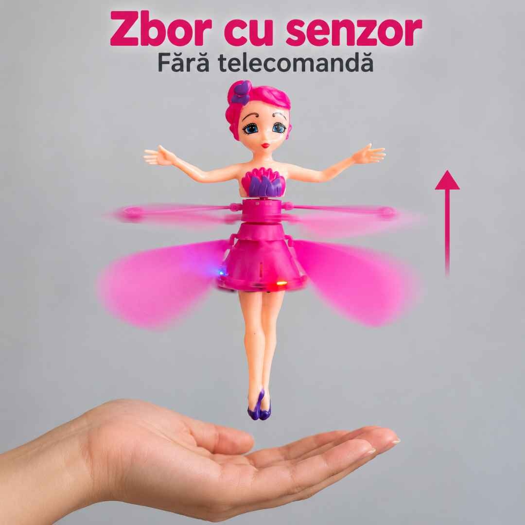Păpușă roz în zbor deasupra palmei, cu săgeată care indică ridicarea și mențiunea fără telecomandă