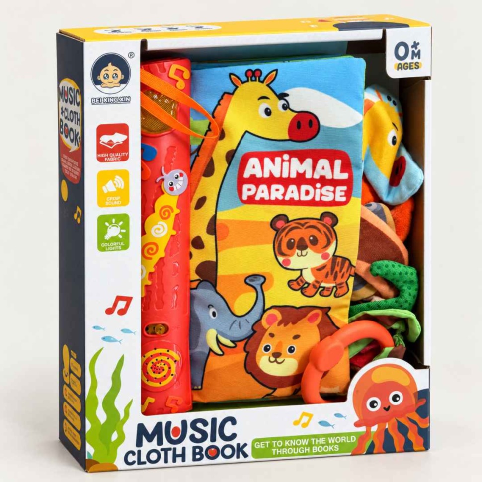 Cartea textilă muzicală Animal Paradise în ambalajul original, cu inelul de agățare vizibil