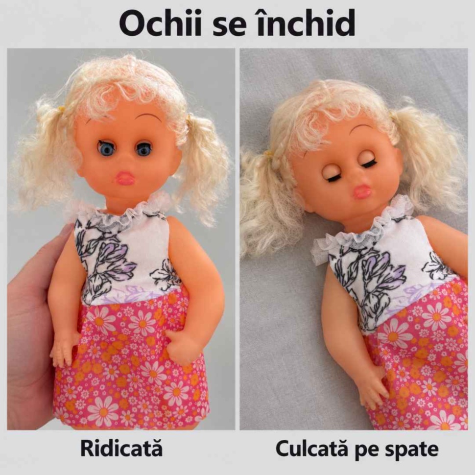 Păpușa cu ochii deschiși când este ridicată și cu ochii închiși când este culcată pe spate